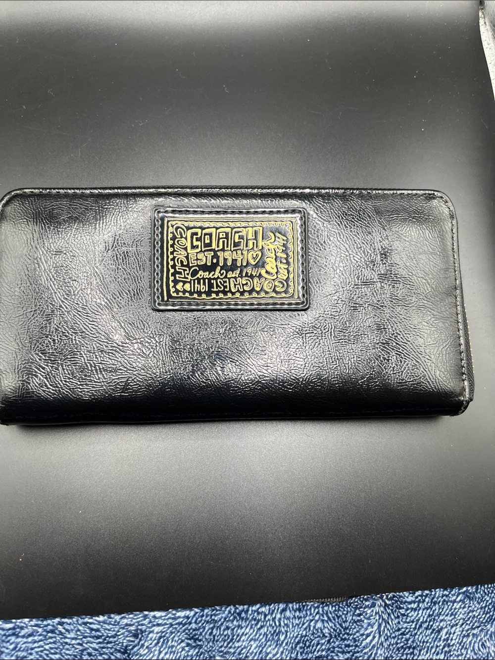 Coach Black Leather Zip-Around Wallet with Gold Plaque
